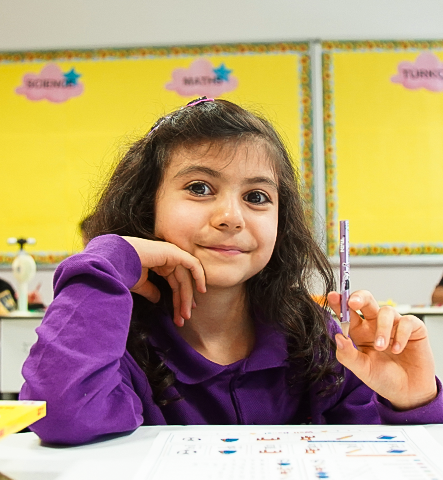 Teacher supporting students during classroom activity